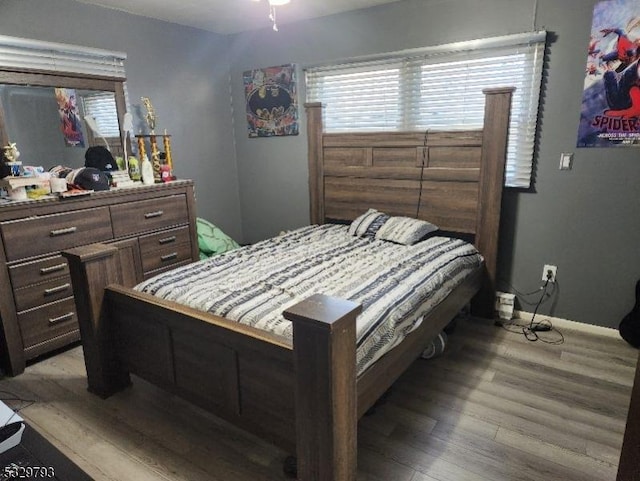 bedroom with light hardwood / wood-style flooring