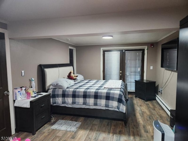 bedroom featuring french doors, dark hardwood / wood-style flooring, baseboard heating, and crown molding