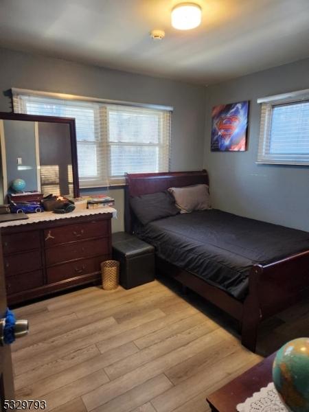 bedroom with light hardwood / wood-style flooring