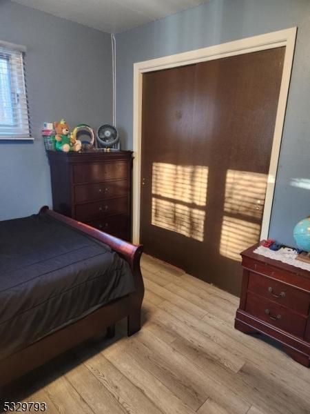 bedroom with light hardwood / wood-style flooring