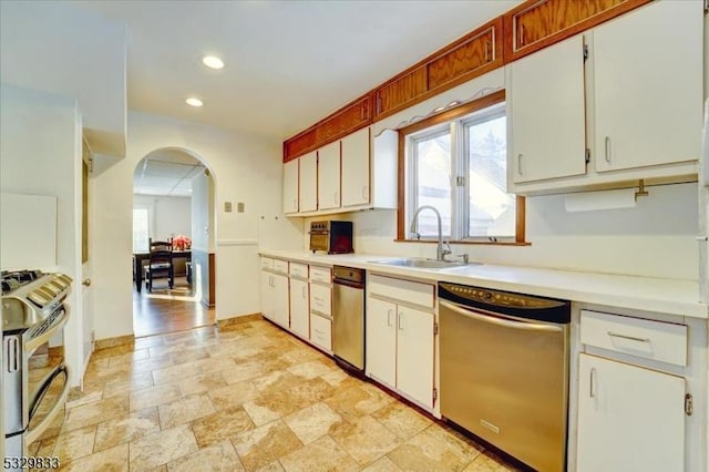 kitchen with white cabinets, sink, and stainless steel appliances