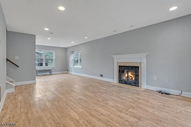 unfurnished living room featuring light hardwood / wood-style floors