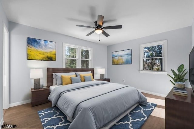 bedroom featuring ceiling fan and hardwood / wood-style flooring