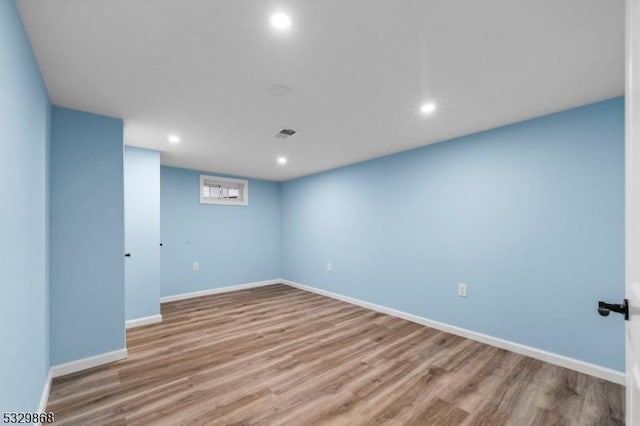 unfurnished room featuring hardwood / wood-style flooring