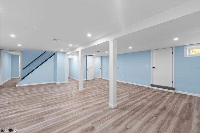 basement featuring light hardwood / wood-style flooring