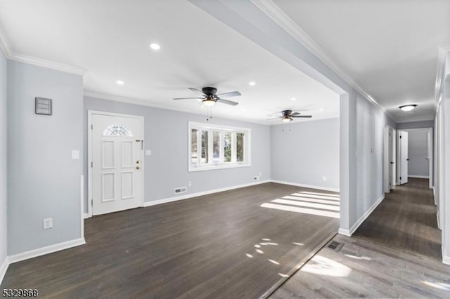 unfurnished living room featuring ceiling fan, dark hardwood / wood-style floors, and ornamental molding