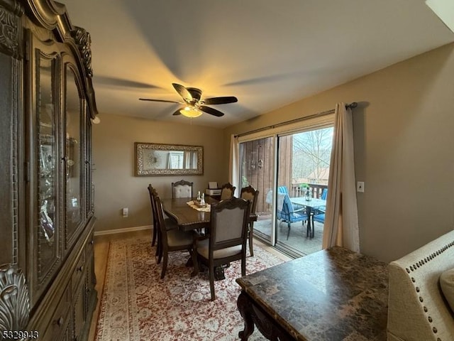 dining space featuring ceiling fan and light hardwood / wood-style floors