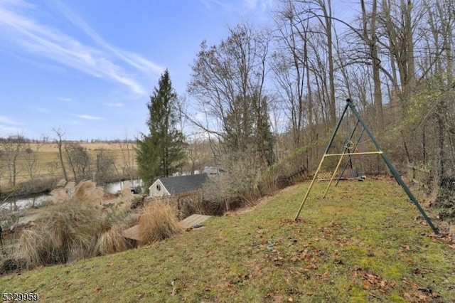 view of yard with a rural view and a playground