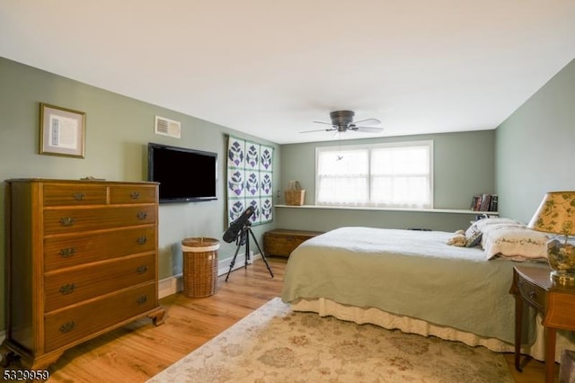 bedroom featuring ceiling fan and hardwood / wood-style floors