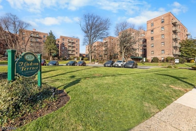 view of home's community featuring a yard