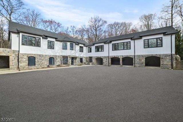 136-2 Mount Harmony Rd, Bernardsville Boro, NJ 07924 - view of front of home featuring a garage, stone siding, and driveway