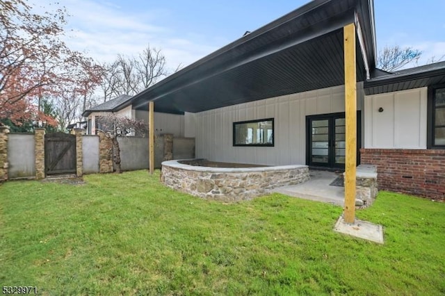 136-2 Mount Harmony Rd, Bernardsville Boro, NJ 07924 - back of house featuring a gate, fence, french doors, a lawn, and brick siding