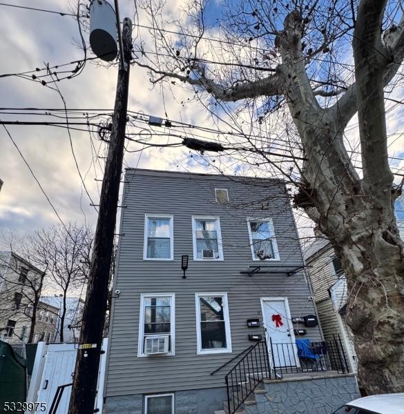 view of front of home with cooling unit