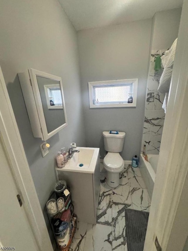 full bathroom featuring shower / washtub combination, vanity, and toilet