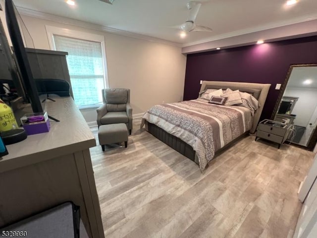 bedroom with ceiling fan and crown molding