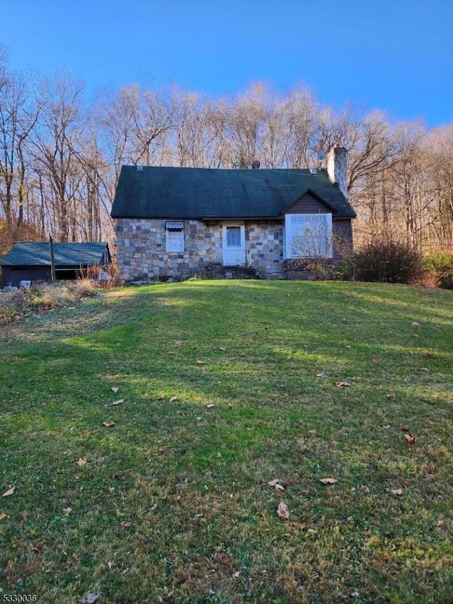 view of front of home with a front yard