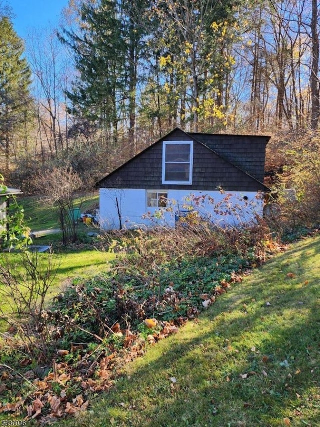 view of outbuilding with a yard