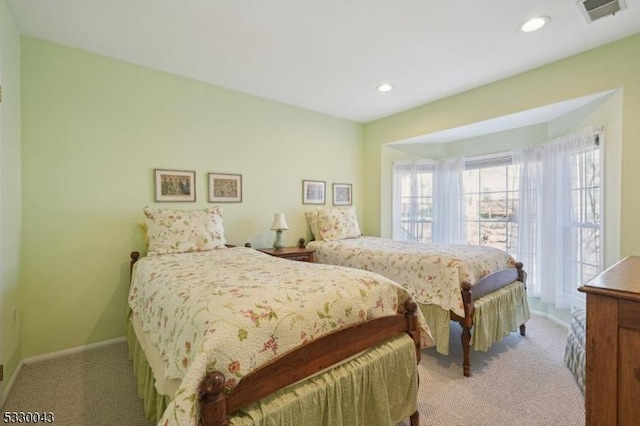 bedroom featuring carpet floors, recessed lighting, visible vents, and baseboards