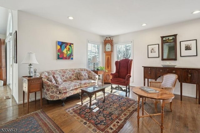 living area with recessed lighting and wood finished floors