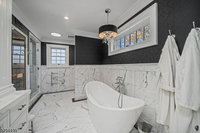 bathroom featuring vanity, ornamental molding, independent shower and bath, and a chandelier