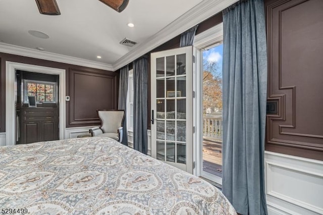 bedroom with access to exterior, multiple windows, and crown molding