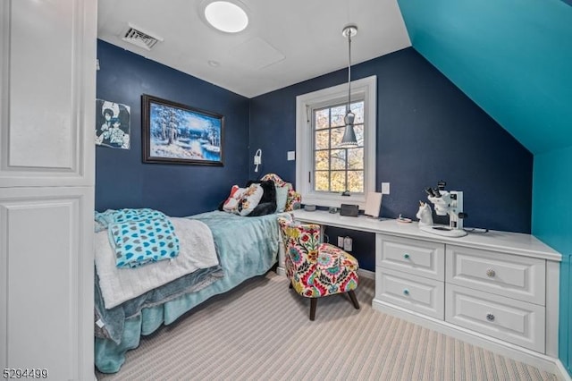 bedroom featuring light carpet and vaulted ceiling