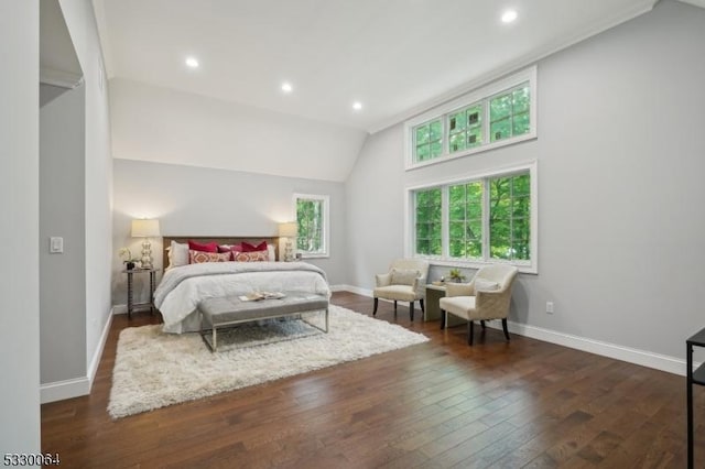 bedroom with lofted ceiling, dark wood-style flooring, recessed lighting, and baseboards