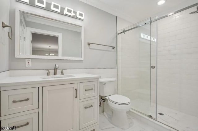 full bath with toilet, vanity, marble finish floor, a stall shower, and crown molding