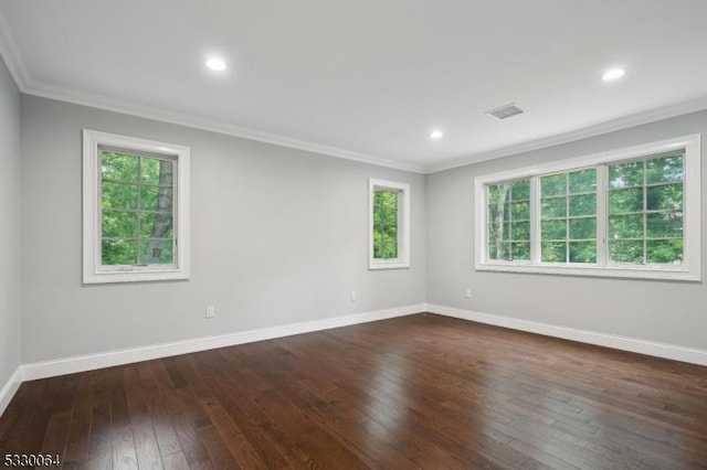 unfurnished room featuring baseboards, dark wood-type flooring, crown molding, and recessed lighting