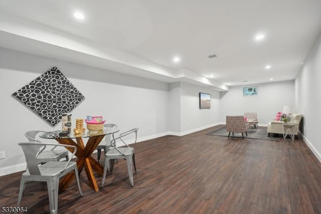 dining space featuring recessed lighting, baseboards, and wood finished floors