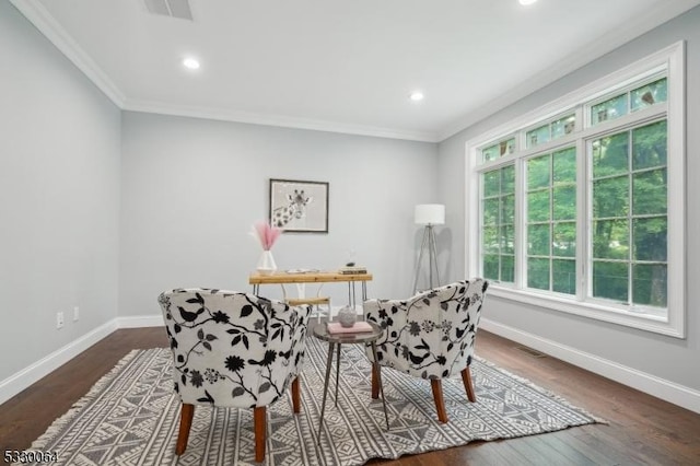 sitting room featuring crown molding, dark wood finished floors, and baseboards