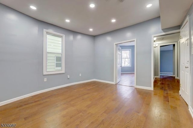 unfurnished room with light hardwood / wood-style floors