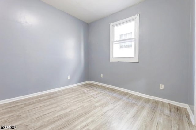 unfurnished room featuring light hardwood / wood-style flooring