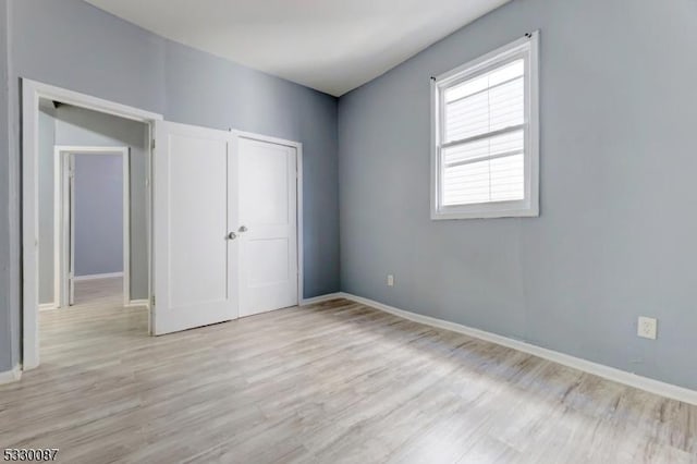 unfurnished bedroom featuring light hardwood / wood-style flooring