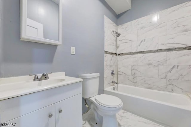 full bathroom with toilet, vanity, and tiled shower / bath