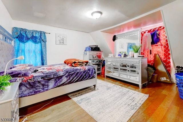 bedroom with hardwood / wood-style flooring