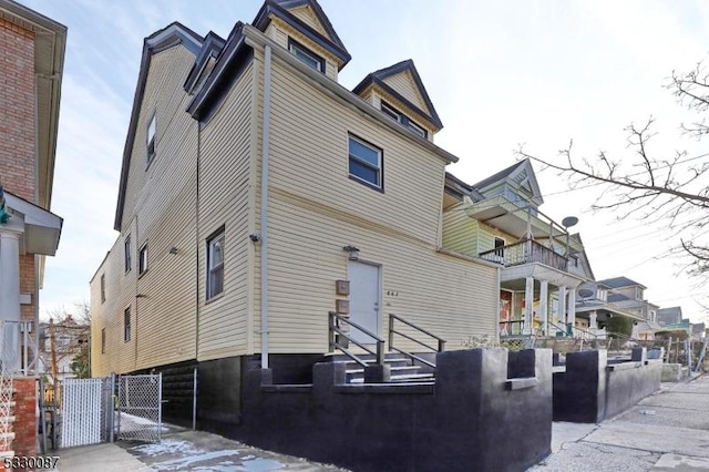 rear view of house featuring a balcony