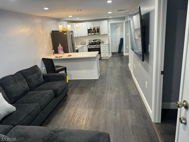 living room featuring dark wood-type flooring