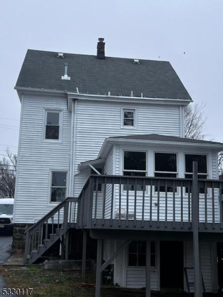 rear view of property with a deck