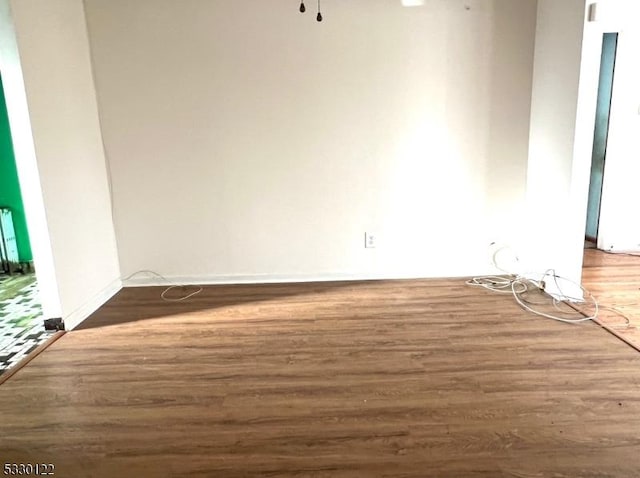 empty room with dark hardwood / wood-style floors