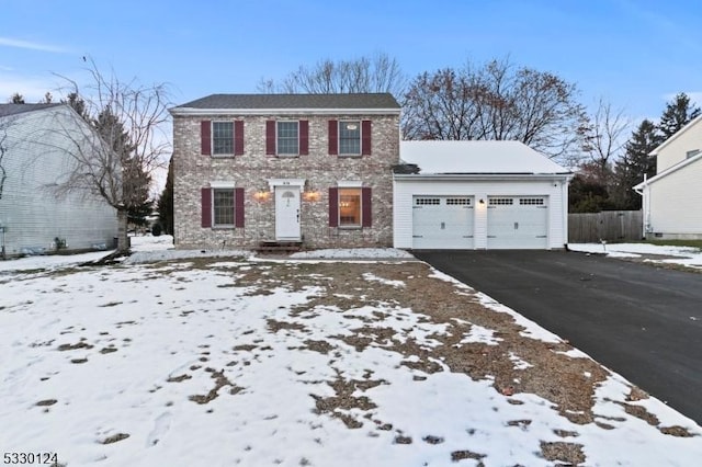 colonial inspired home featuring a garage