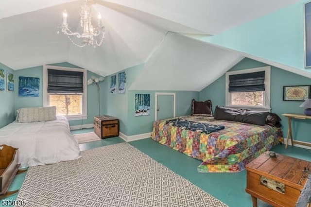 bedroom with vaulted ceiling and a chandelier