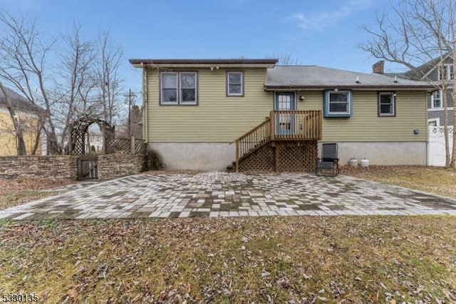 rear view of property featuring a patio