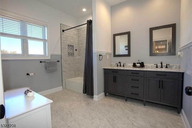 bathroom with shower / bath combination with curtain and vanity