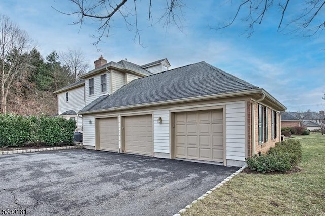 view of side of home with a garage