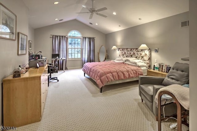 carpeted bedroom featuring ceiling fan and vaulted ceiling