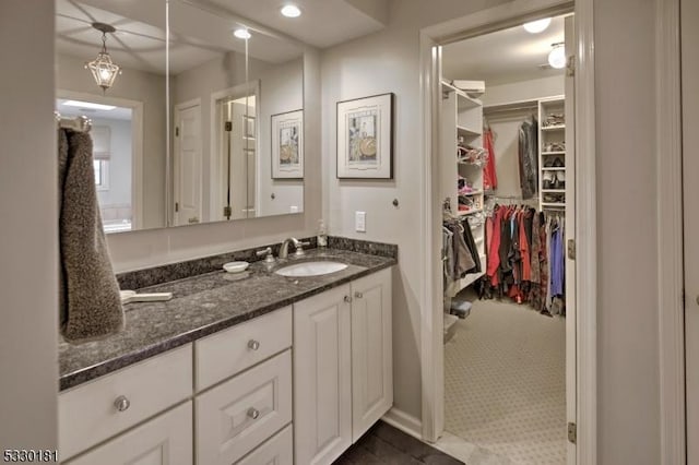 bathroom with tile patterned floors and vanity