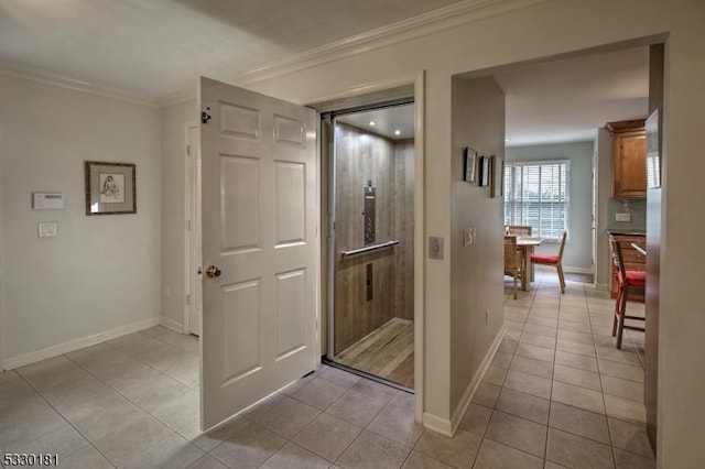 corridor featuring ornamental molding and light tile patterned floors