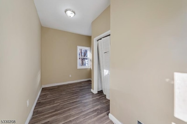 empty room featuring dark hardwood / wood-style flooring