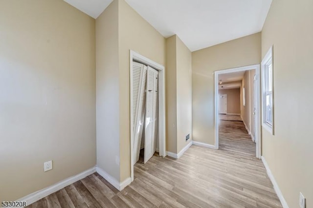 interior space with light hardwood / wood-style flooring and a closet